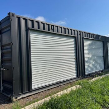 Black 40-foot shipping container with three roll-up doors for sale in Huntsville, Alabama